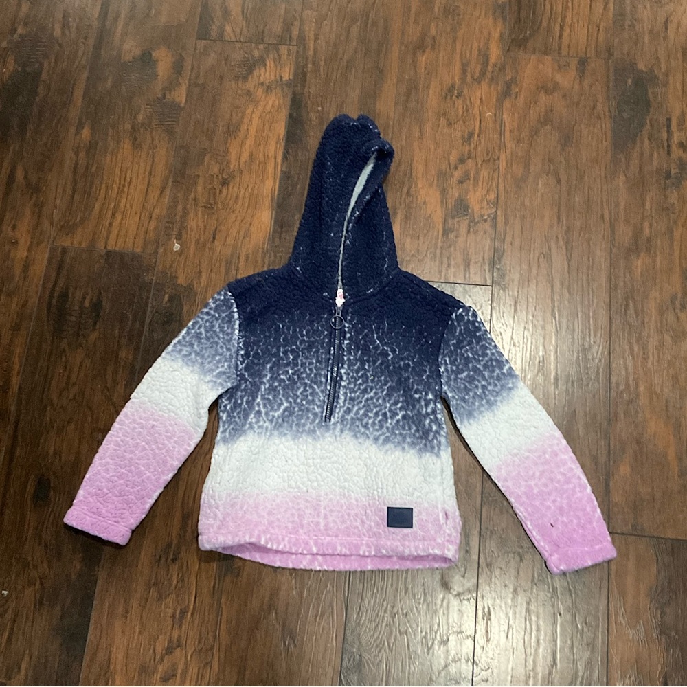 Justice sweater, puffy, soft, and cozy.